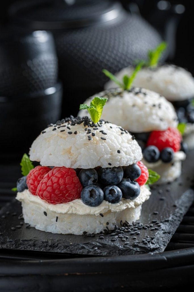 Unique sush burger with berries and sesame sprinkled with sesame.